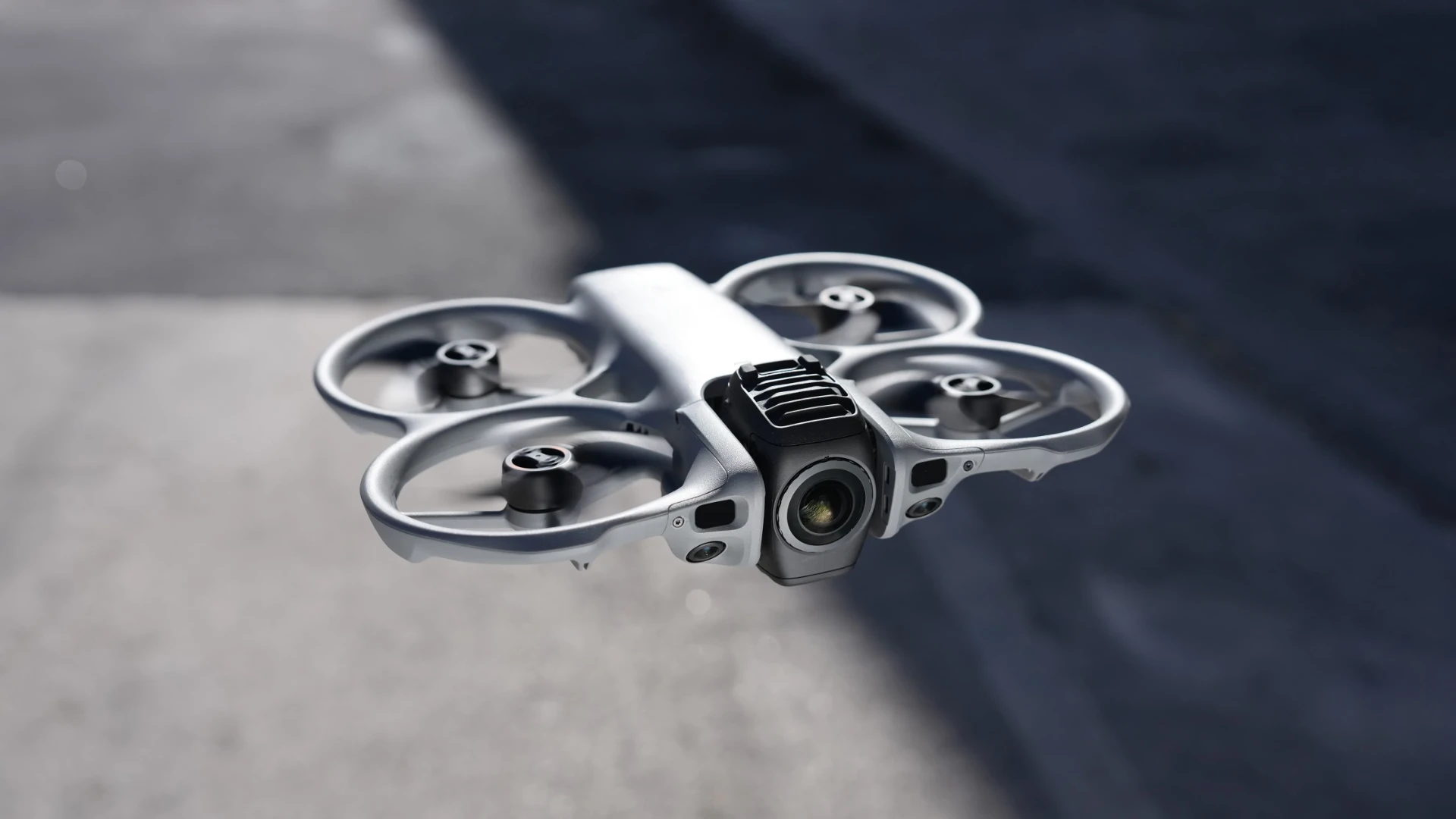 FANTM Avata 360 with integrated propeller guards in flight above a villa.